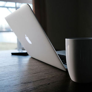 A laptop set up for a video telehealth session.